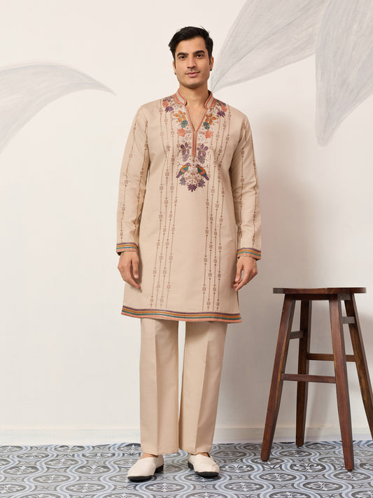 Classic Beige Embroidered Kurta Set with Signature Floral & Bird Artistry